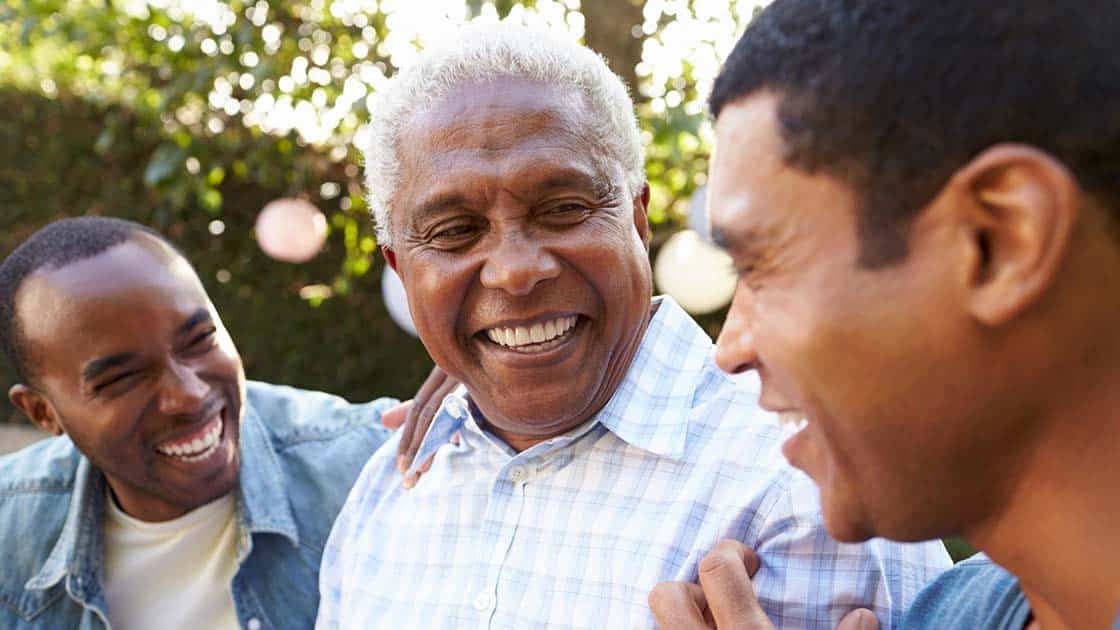 Father laughing with sons Photo