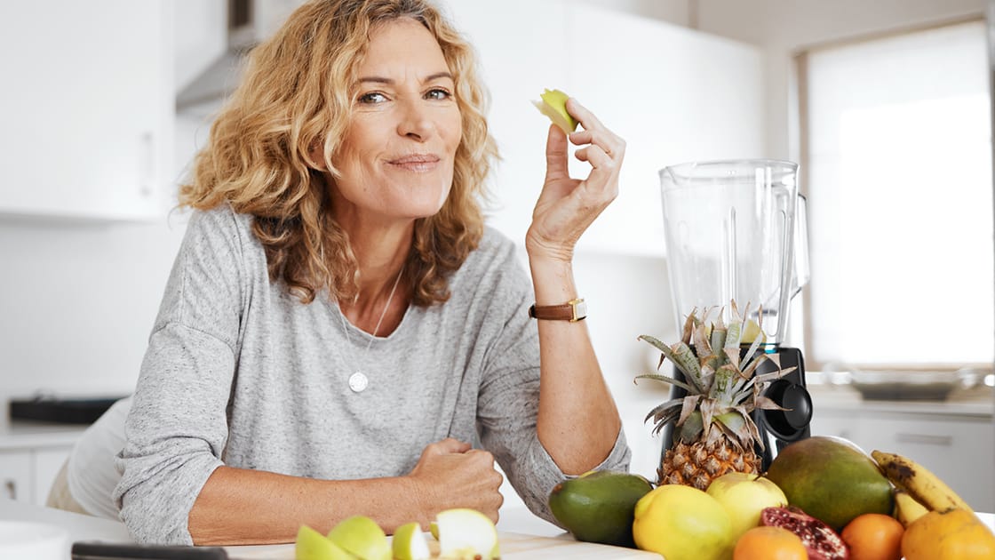 Woman Eating Apple Slices Photo