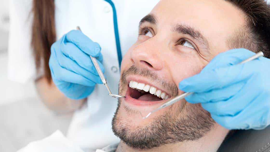 Smiling Man in Dentist Chair Photo