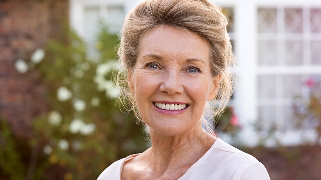 Smiling Woman in Garden