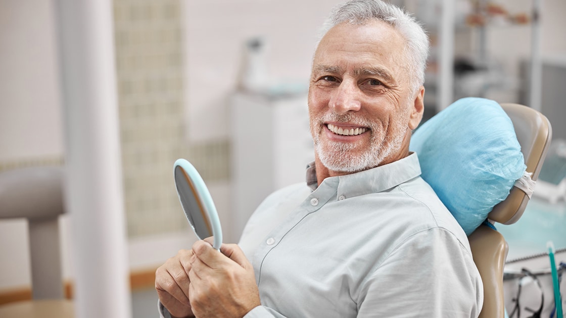 Smiling Man in Dental Chair