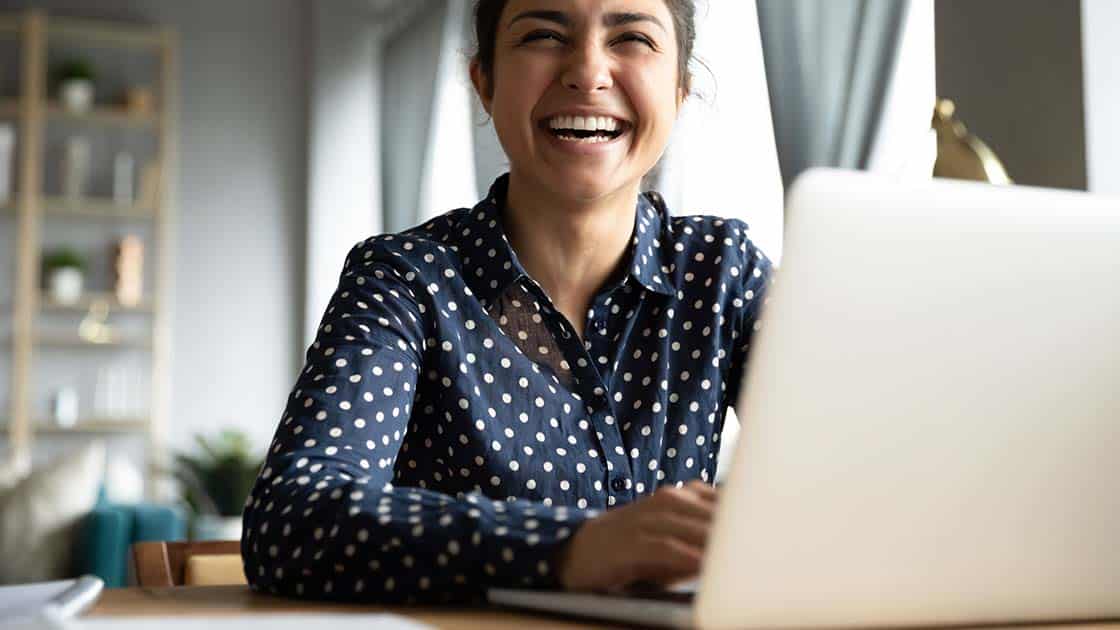 Smiling Woman Using the Computer Photo